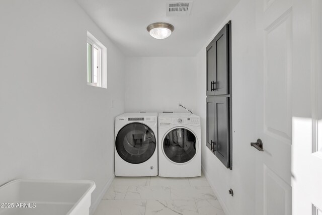 7607 N 42nd Ln, Phoenix, AZ 85051 - laundry room featuring cabinet space, washing machine and dryer, light marble finish flooring, and baseboards