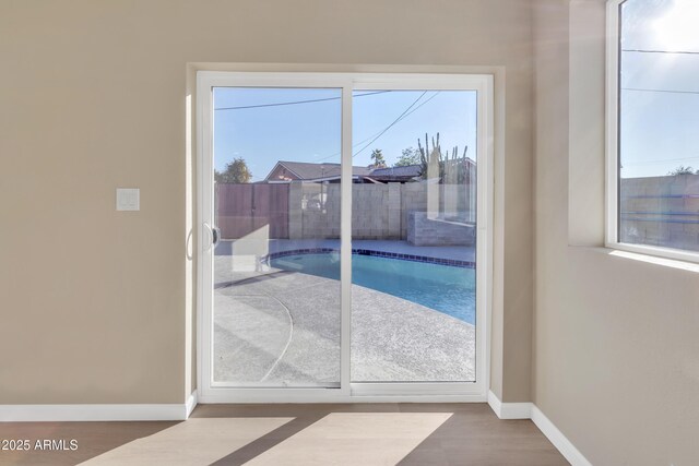 7607 N 42nd Ln, Phoenix, AZ 85051 - entryway featuring baseboards and wood finished floors