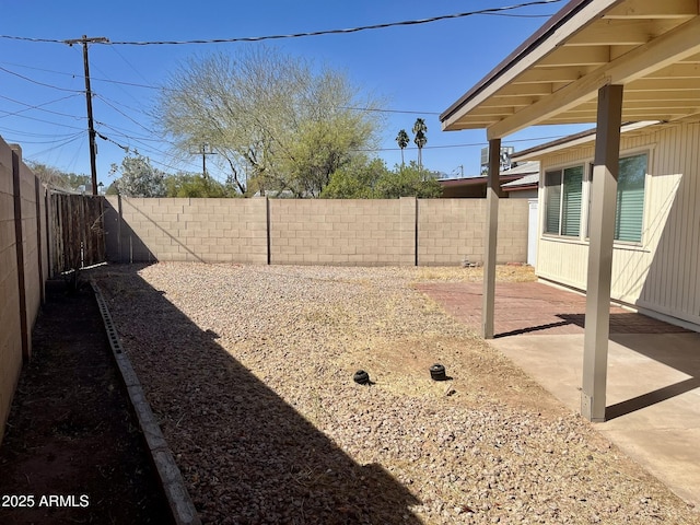 view of yard with a patio and a fenced backyard