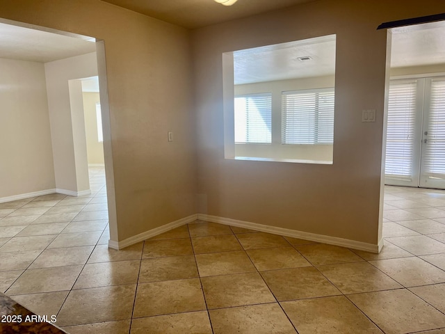 tiled spare room with baseboards