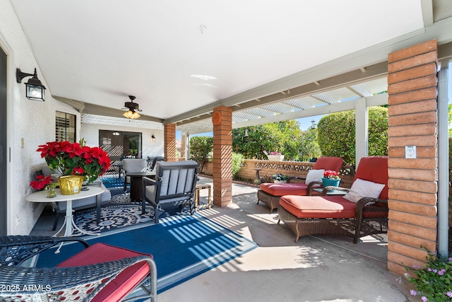 view of patio featuring an outdoor living space, ceiling fan, and a pergola