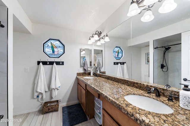 bathroom featuring vanity and an enclosed shower