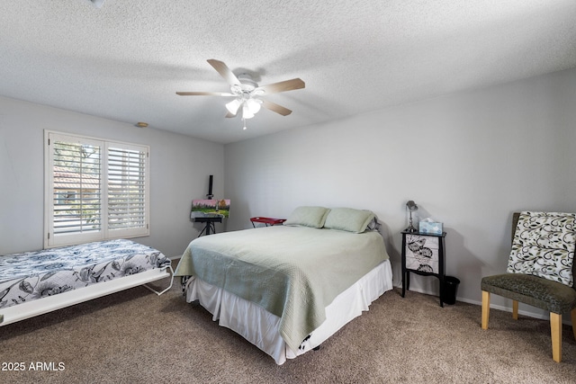 carpeted bedroom featuring ceiling fan and a textured ceiling