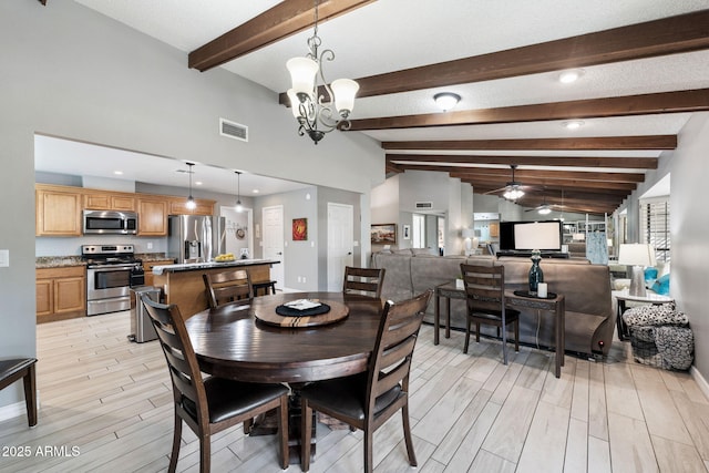 dining space with lofted ceiling with beams and ceiling fan with notable chandelier