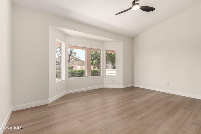 4010 N 156th Ln, Goodyear, AZ 85395 - spare room featuring light wood-style flooring, baseboards, and a ceiling fan