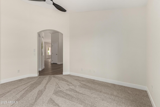 4010 N 156th Ln, Goodyear, AZ 85395 - empty room featuring arched walkways, carpet flooring, baseboards, and ceiling fan
