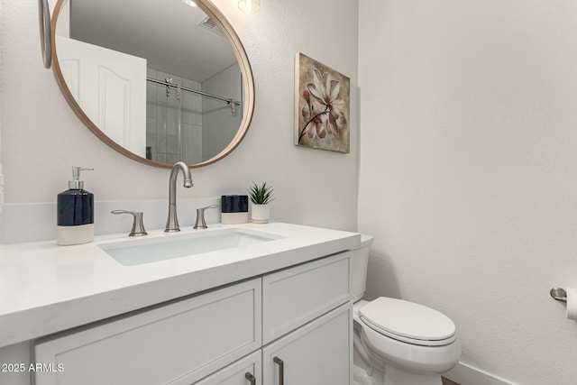 4010 N 156th Ln, Goodyear, AZ 85395 - full bathroom with an enclosed shower, visible vents, toilet, and vanity