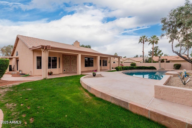 4010 N 156th Ln, Goodyear, AZ 85395 - exterior space featuring a patio area, a yard, a chimney, fence, and stucco siding