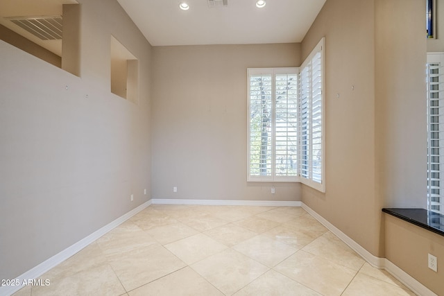 empty room with light tile patterned flooring