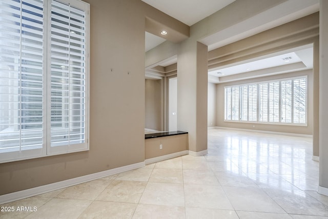 empty room with light tile patterned floors