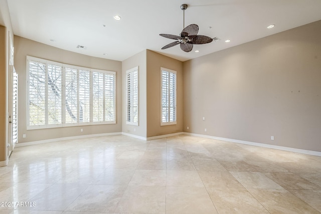 unfurnished room with light tile patterned floors and ceiling fan