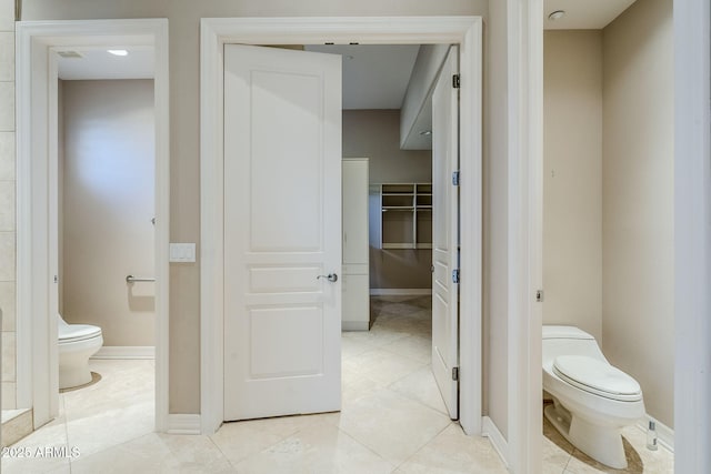 bathroom with tile patterned floors and toilet