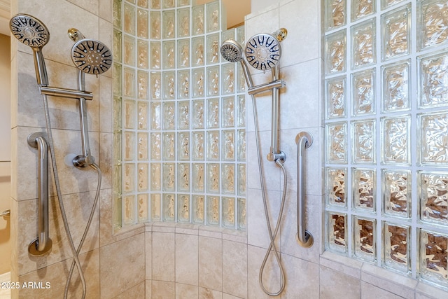 bathroom with a tile shower