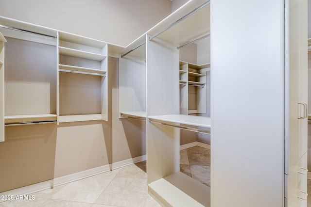 spacious closet featuring tile patterned flooring