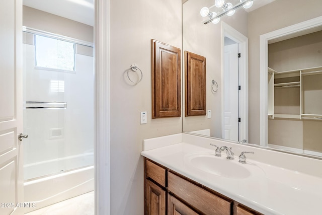 bathroom with vanity and bathtub / shower combination