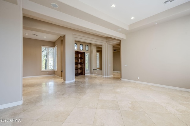 unfurnished living room featuring light tile patterned floors