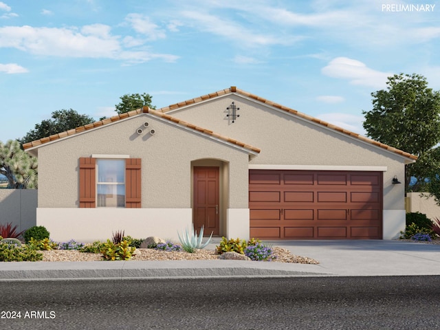 mediterranean / spanish-style house featuring concrete driveway, an attached garage, fence, and stucco siding