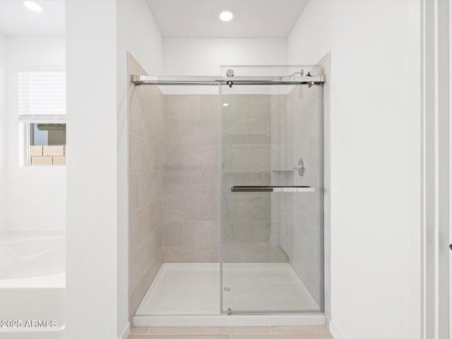 full bathroom with a shower stall and recessed lighting