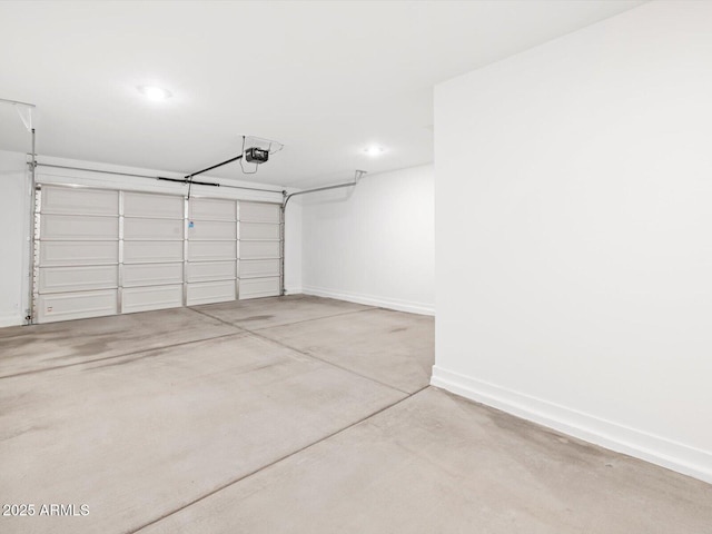 garage with recessed lighting, baseboards, and a garage door opener