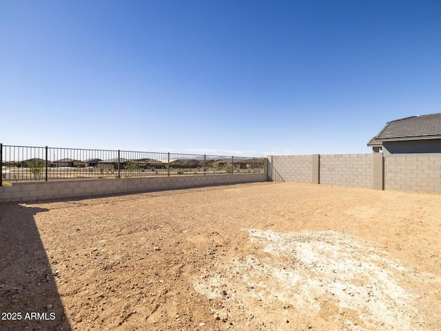 view of yard with a fenced backyard