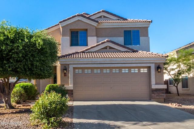 mediterranean / spanish-style house featuring a garage