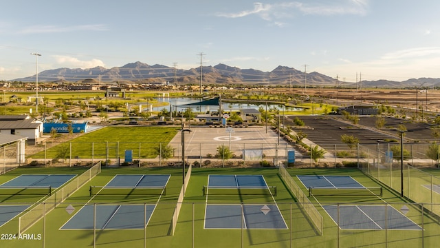 birds eye view of property featuring a water and mountain view