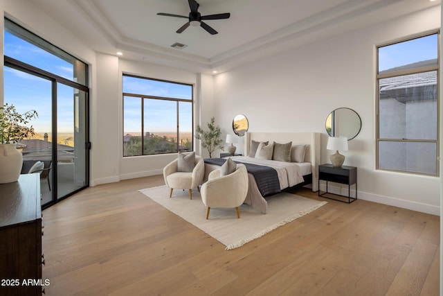 13631 E Windrose Dr, Scottsdale, AZ 85259 - bedroom with access to exterior, light wood-style floors, baseboards, a tray ceiling, and recessed lighting
