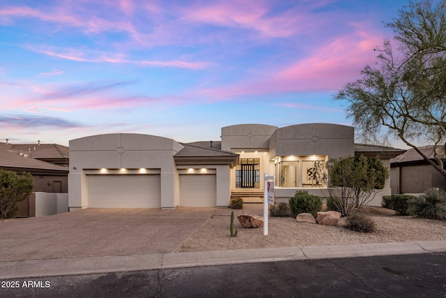 13631 E Windrose Dr, Scottsdale, AZ 85259 - view of front of house with driveway, stucco siding, and a garage
