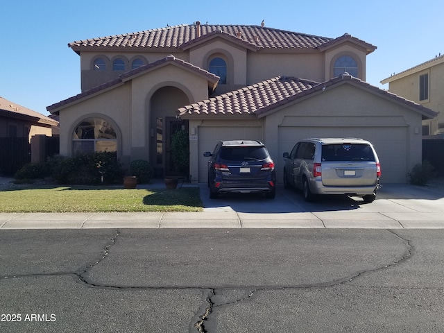 view of front of property featuring a front yard and a garage