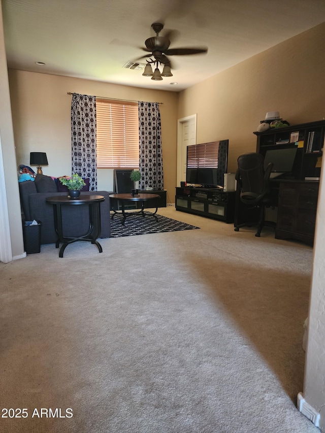 home office featuring ceiling fan and carpet floors