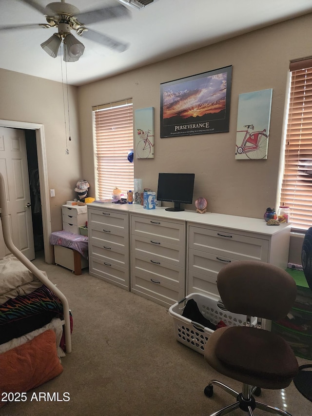 carpeted bedroom with ceiling fan