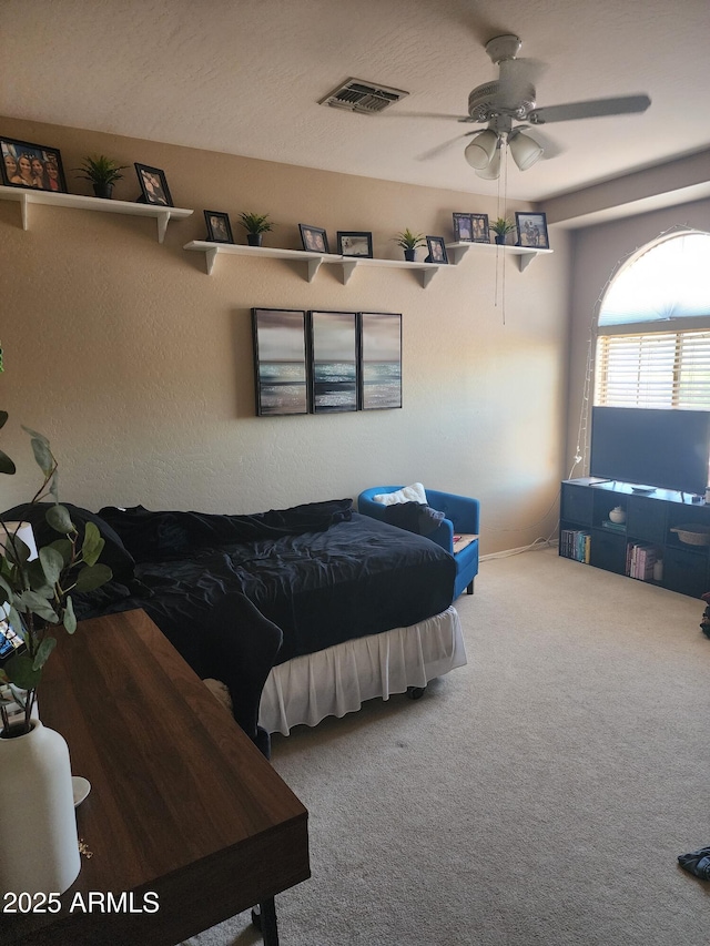 bedroom with ceiling fan and carpet flooring