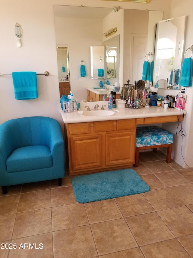 bathroom featuring tile patterned flooring and vanity