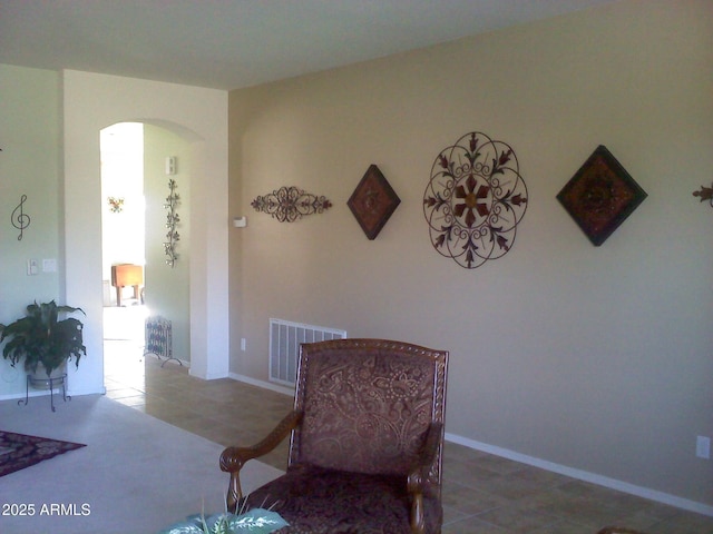 living area featuring tile patterned flooring