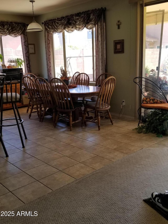 dining area featuring tile patterned flooring