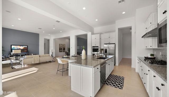27908 N 38th Dr, Phoenix, AZ 85083 - kitchen featuring white cabinets, stainless steel appliances, a sink, visible vents, and backsplash