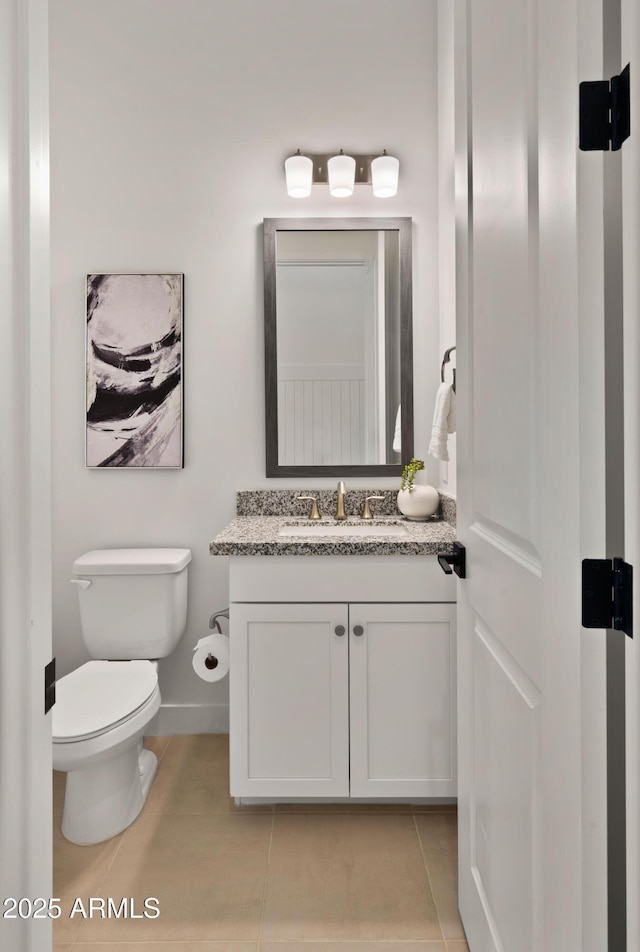 27908 N 38th Dr, Phoenix, AZ 85083 - half bathroom featuring tile patterned floors, baseboards, vanity, and toilet