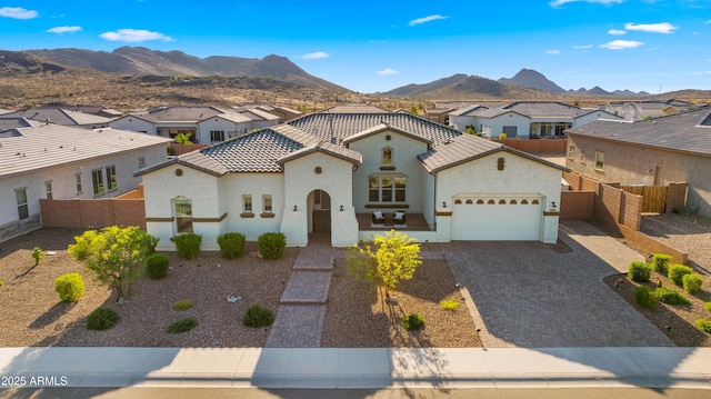27908 N 38th Dr, Phoenix, AZ 85083 - mediterranean / spanish home featuring a garage, a residential view, a tiled roof, and stucco siding