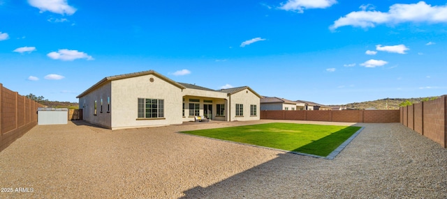 27908 N 38th Dr, Phoenix, AZ 85083 - rear view of property with a fenced backyard, a patio area, a lawn, and stucco siding
