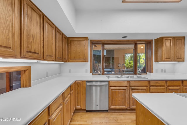 8604 S Oak St, Tempe, AZ 85284 - kitchen with dishwasher, light countertops, light wood-style floors, and brown cabinets