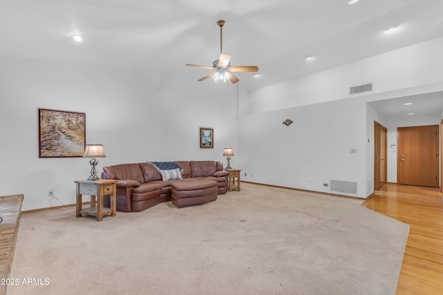 8604 S Oak St, Tempe, AZ 85284 - living area with ceiling fan, recessed lighting, a high ceiling, light wood-style flooring, and light colored carpet