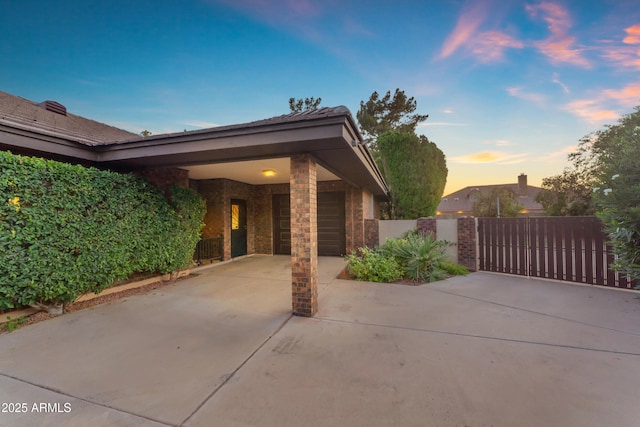 8604 S Oak St, Tempe, AZ 85284 - view of patio featuring a gate, concrete driveway, and a garage