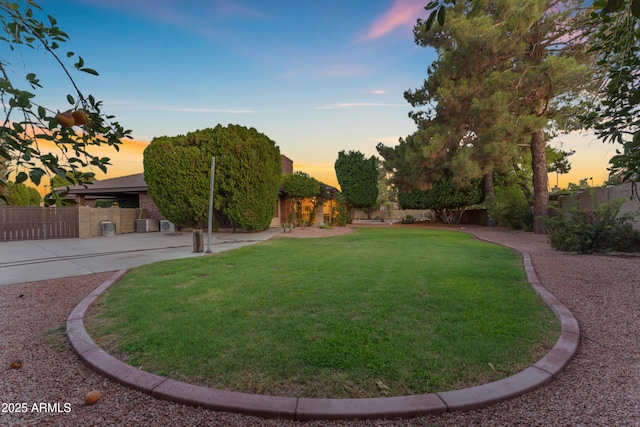 8604 S Oak St, Tempe, AZ 85284 - yard at dusk featuring a fenced backyard