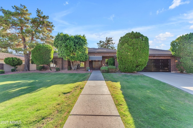 8604 S Oak St, Tempe, AZ 85284 - view of front of property with concrete driveway, a garage, and brick siding