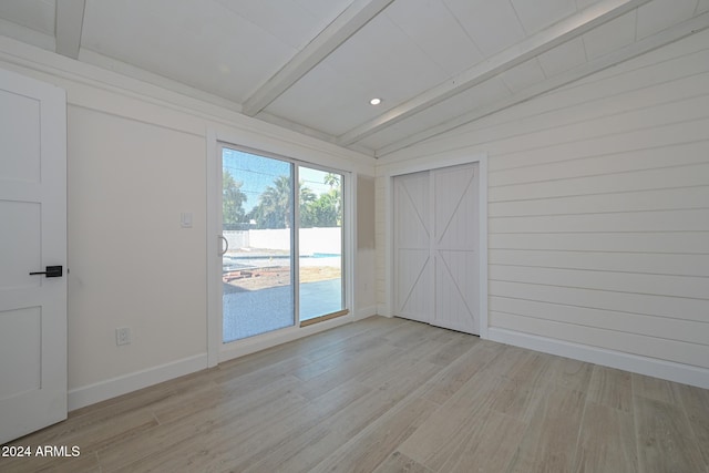 6312 N 13th St, Phoenix, AZ 85014 - spare room featuring light wood-type flooring, baseboards, wooden walls, and recessed lighting