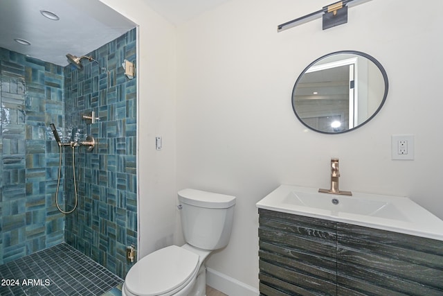 6312 N 13th St, Phoenix, AZ 85014 - full bath featuring toilet, tiled shower, vanity, and baseboards