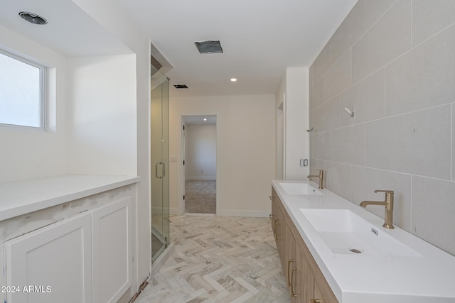 6312 N 13th St, Phoenix, AZ 85014 - bathroom with a stall shower, double vanity, and tile walls