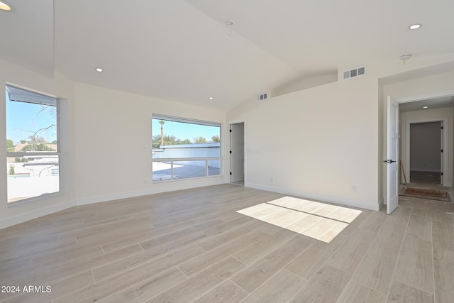 6312 N 13th St, Phoenix, AZ 85014 - spare room with light wood finished floors, vaulted ceiling, baseboards, and recessed lighting