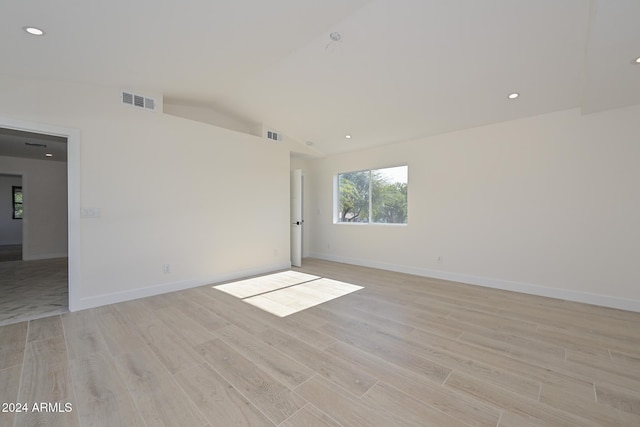 6312 N 13th St, Phoenix, AZ 85014 - empty room with light wood-style flooring, baseboards, lofted ceiling, and recessed lighting