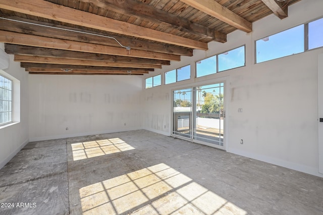 6312 N 13th St, Phoenix, AZ 85014 - empty room featuring wooden ceiling with exposed beams and baseboards